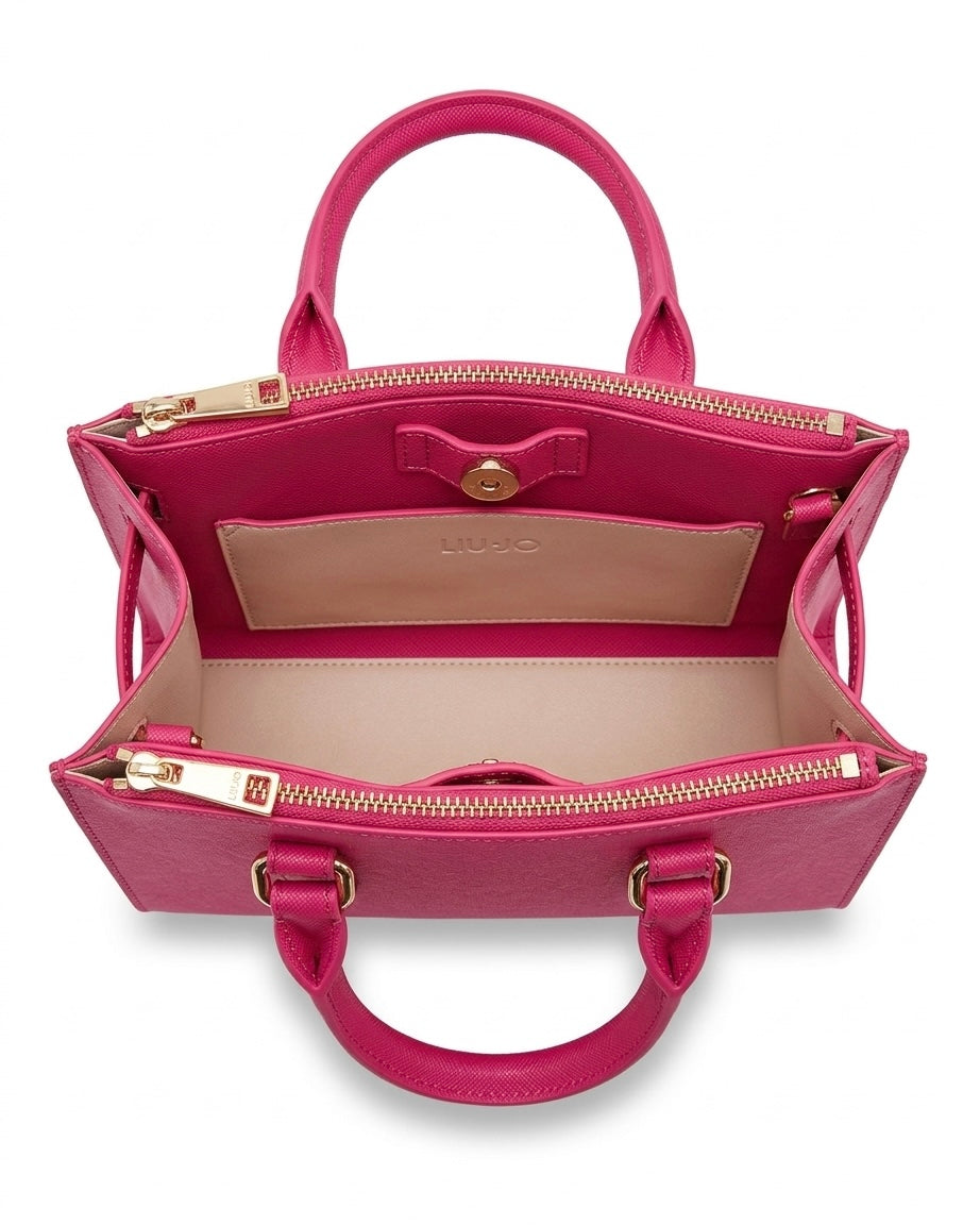 Borsa a mano rigida Liu Jo fucsia acceso con logo grande "LIU·JO MILANO" impresso in rilievo sul davanti, doppi manici e scomparti superiori con cerniere dorate-interno.