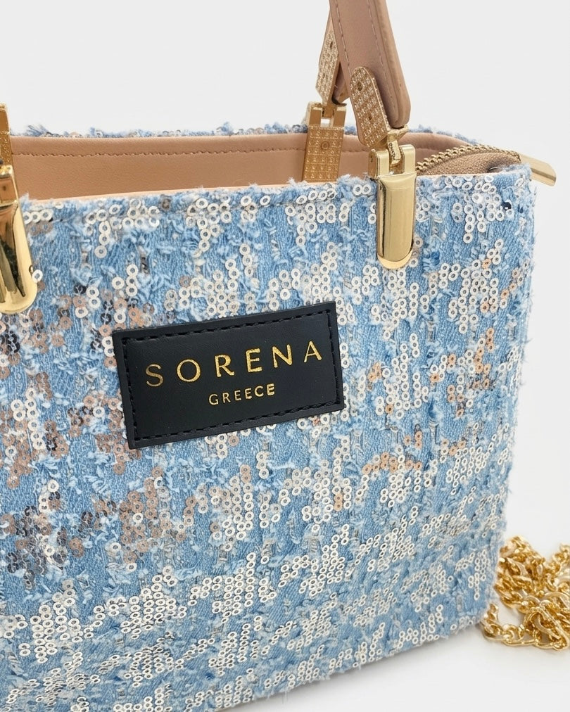 Borsa a mano e tracolla Sorena prodotta in Grecia ricoperta di paillettes azzurre e argento con manici nude, etichetta nera e catena dorata - Buttò Calzature - logo.