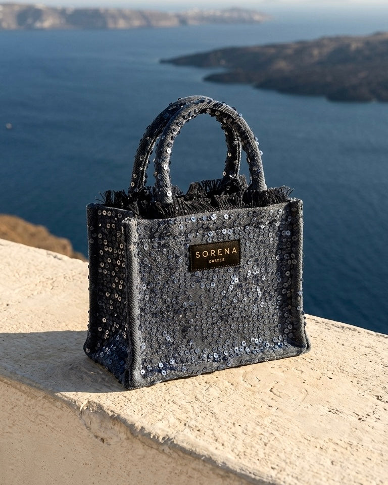 Borsa a mano Sorena prodotta in Grecia in tessuto scuro ricoperto di paillettes blu notte con manici coordinati - Buttò Calzature.