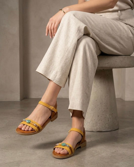 Sandalo basso donna in vera pelle giallo ocra con trama intrecciata pietre colorate e plantare memory foam Buttò Calzature - modella.